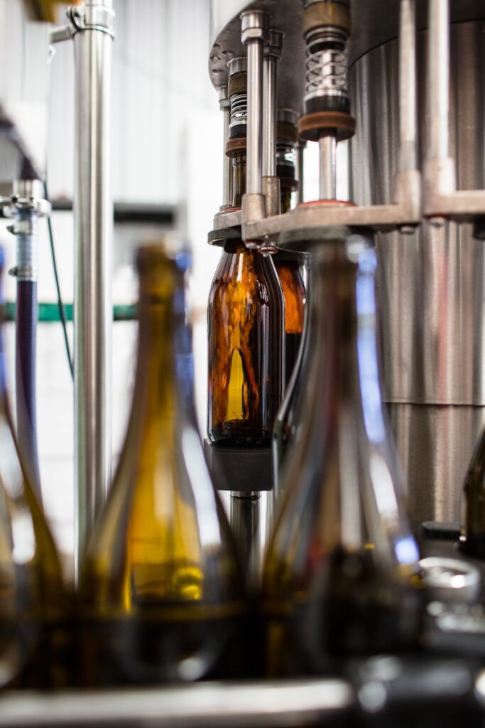 selective focus photography of bottles on rack